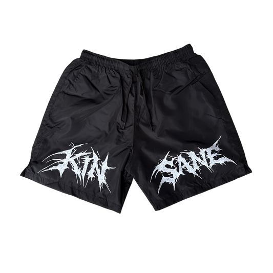 Black shorts with black drawstrings and white lettering reading “KINSANE”