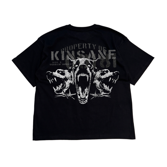 Back view of a black t shirt with a white three dogs design and gray text reading “PROPERTY OF KINSANE DIV. 1 TEKKIN MMXXIV”