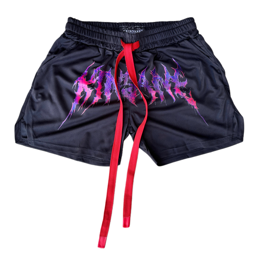 Black athletic shorts with elastic waistband and red drawstrings with red and purple tribal lettering reading “KINSANE” across the middle