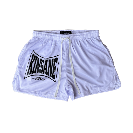 White athletic shorts with white drawstrings and a black logo on the left side with text reading “KINSANE MMXXIV”