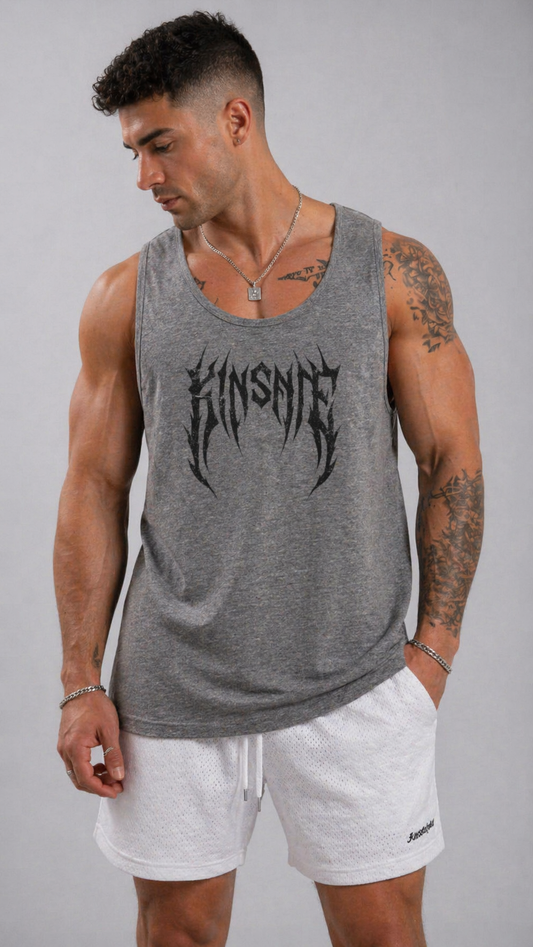 Man wearing a Grey tank top with black tribal lettering reading “KINSANE”