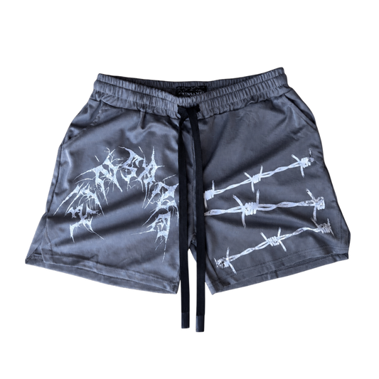 gray athletic shorts with black drawstrings and white text reading “KINSANE” on the left side and white barbed wire design on the right side