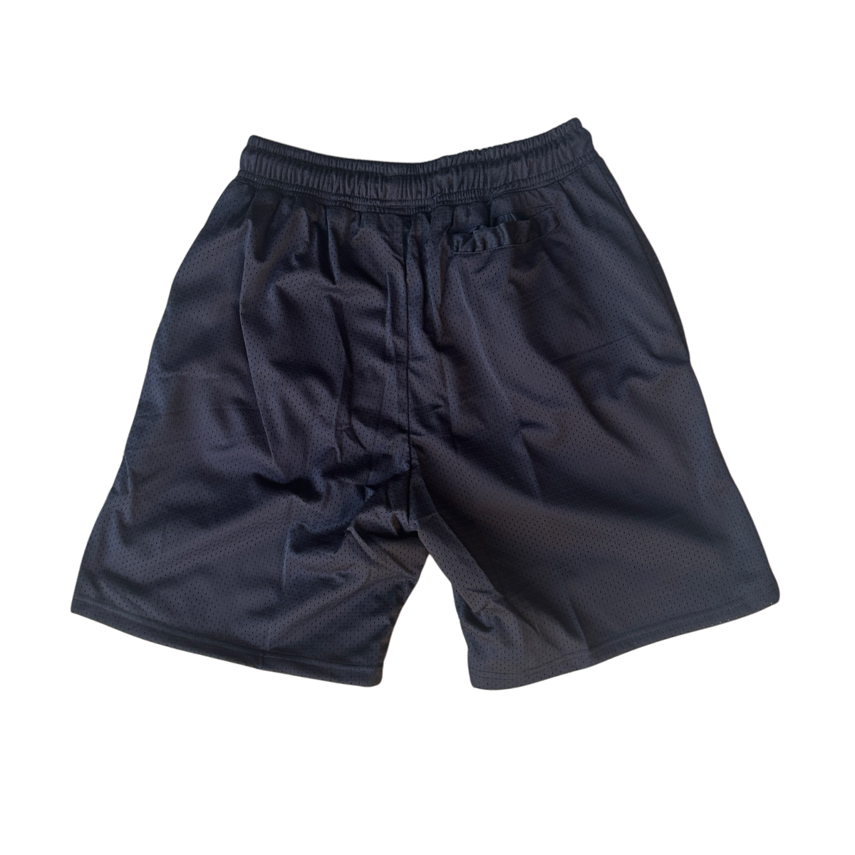Back view of plain black mesh shorts