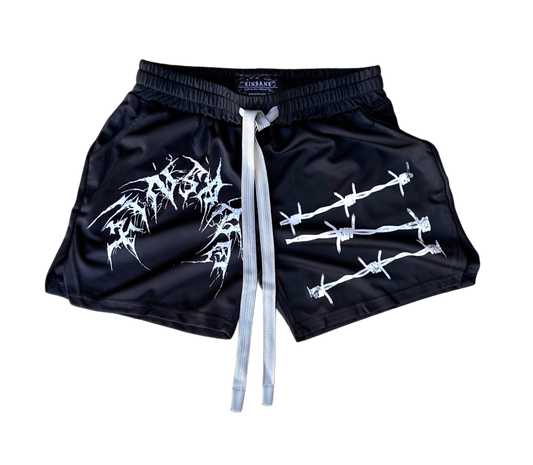 Black athletic shorts with elastic waistband and gray drawstrings and white tribal lettering reading “KINSANE” on the right leg and white barbed wire design on the left leg