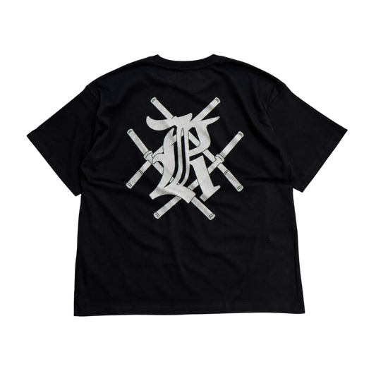 Back view of a black t shirt with white design of bars crossing and the letter K