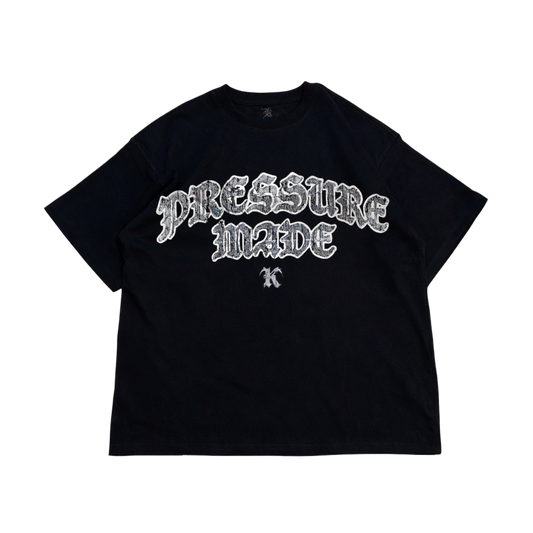 black t shirt with white distressed text reading “PRESSURE MADE K” 