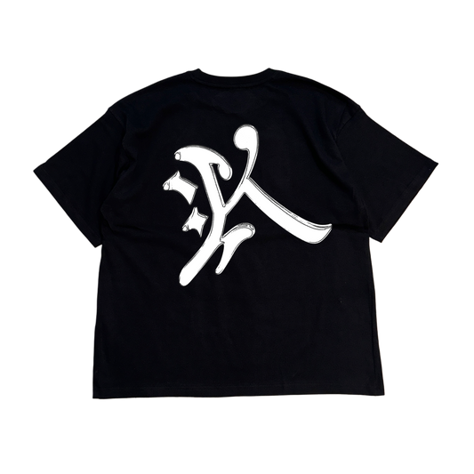 Back view of a black t shirt with a silver letter reading “K” 