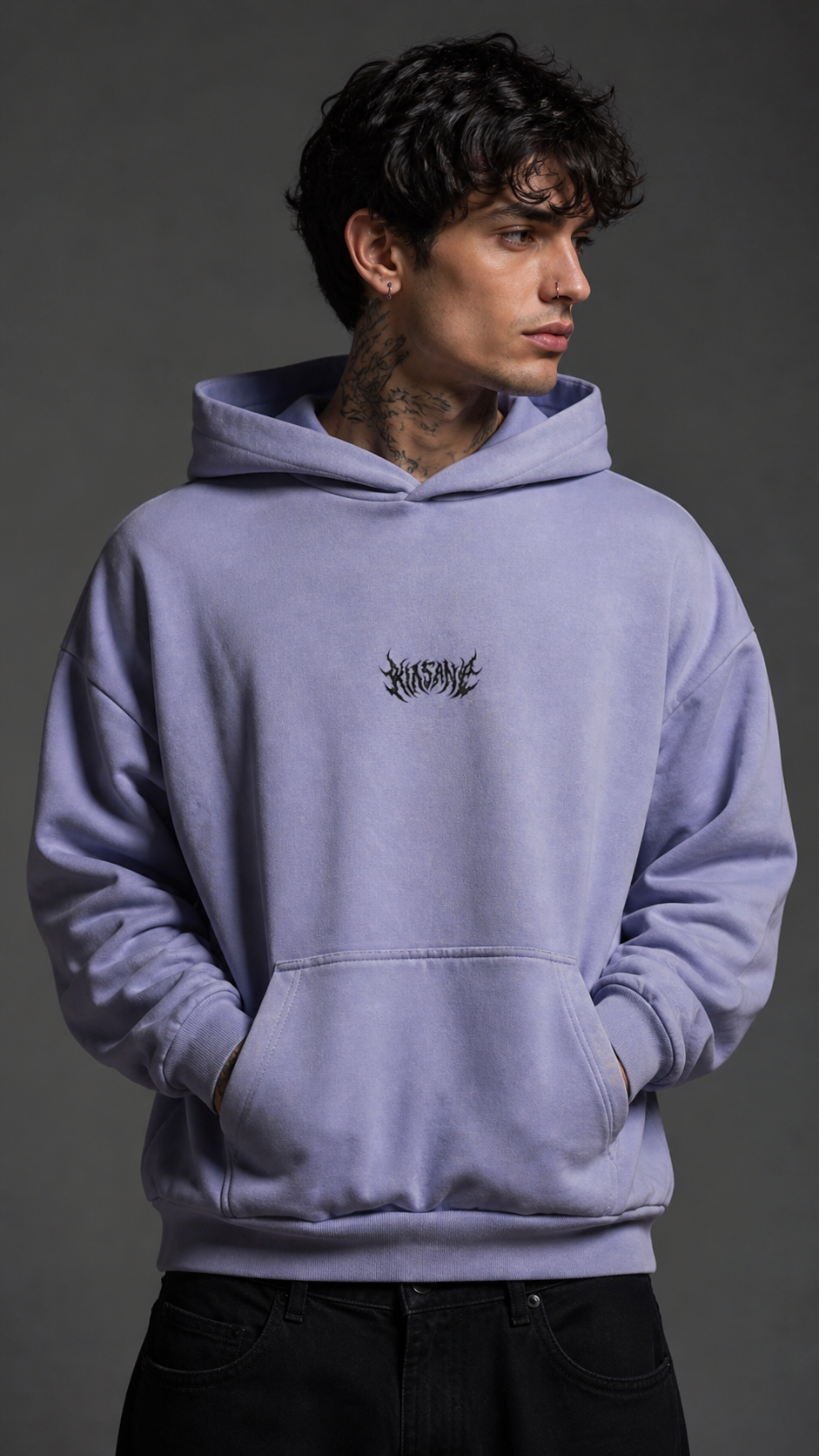 Man wearing Light blue hoodie with black text in the center reading “KINSANE” 