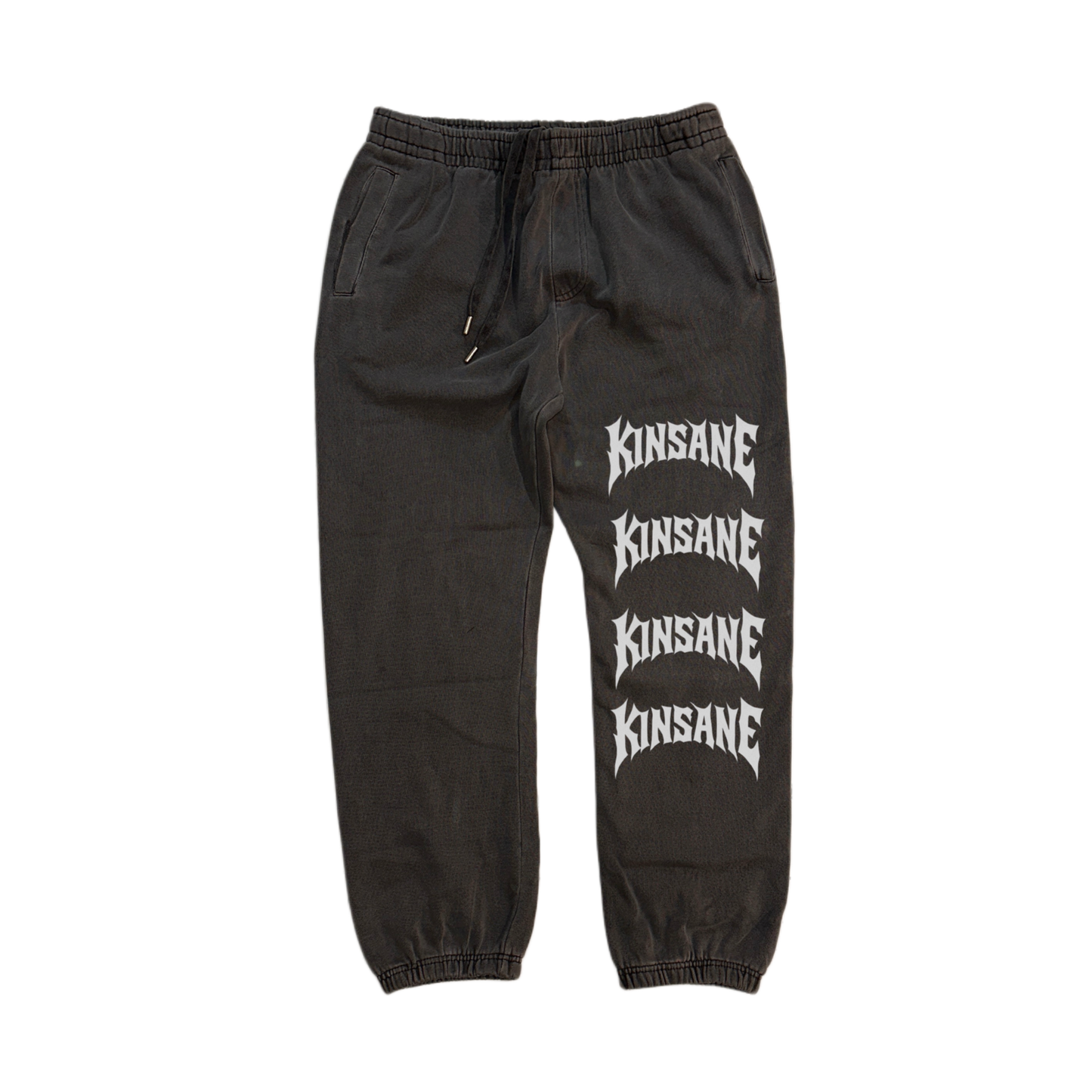 grey cuffed joggers with stacked white lettering reading “KINSANE” four times on the right side 