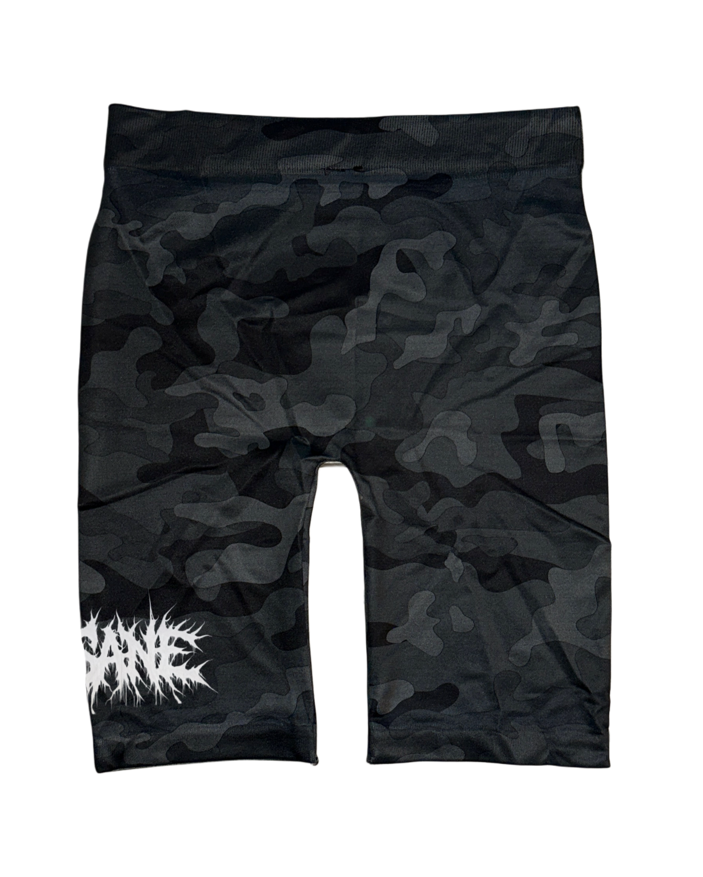 Back view of Black and grey camo compression shorts with white chaotic lettering reading “SANE” on the left leg 