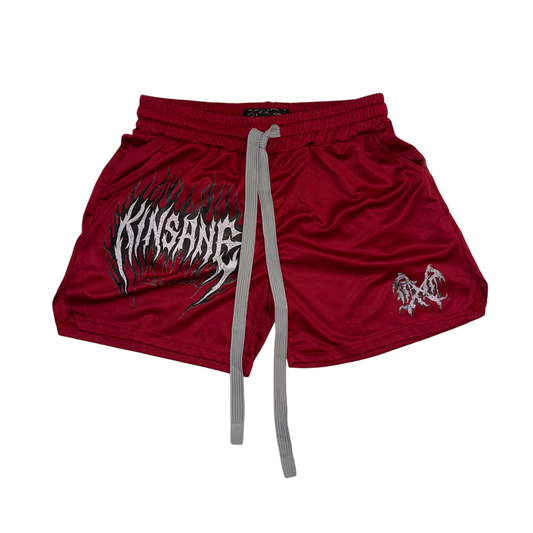 Dark red athletic shorts with elastic waists and, gray drawstrings and a white flamed lettering on the right leg reading “KINSANE” and a small white logo on the left leg 