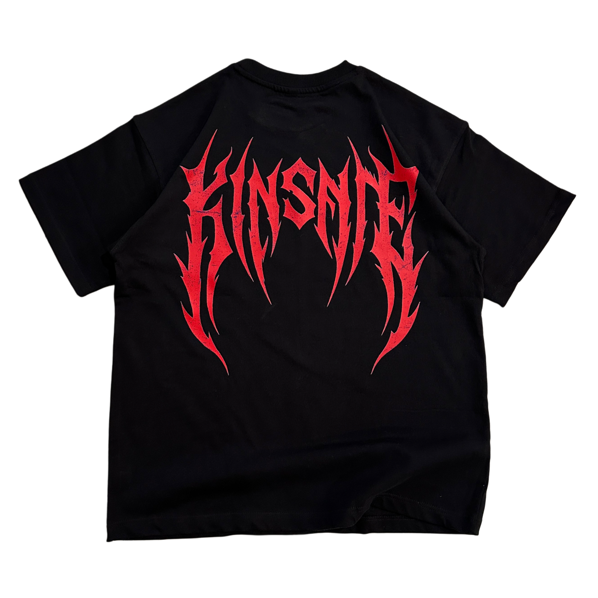 Back view of a black T-shirt with red tribal lettering reading “KINSANE” 