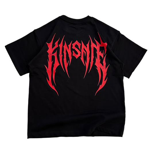Back view of a black T-shirt with red tribal lettering reading “KINSANE” 