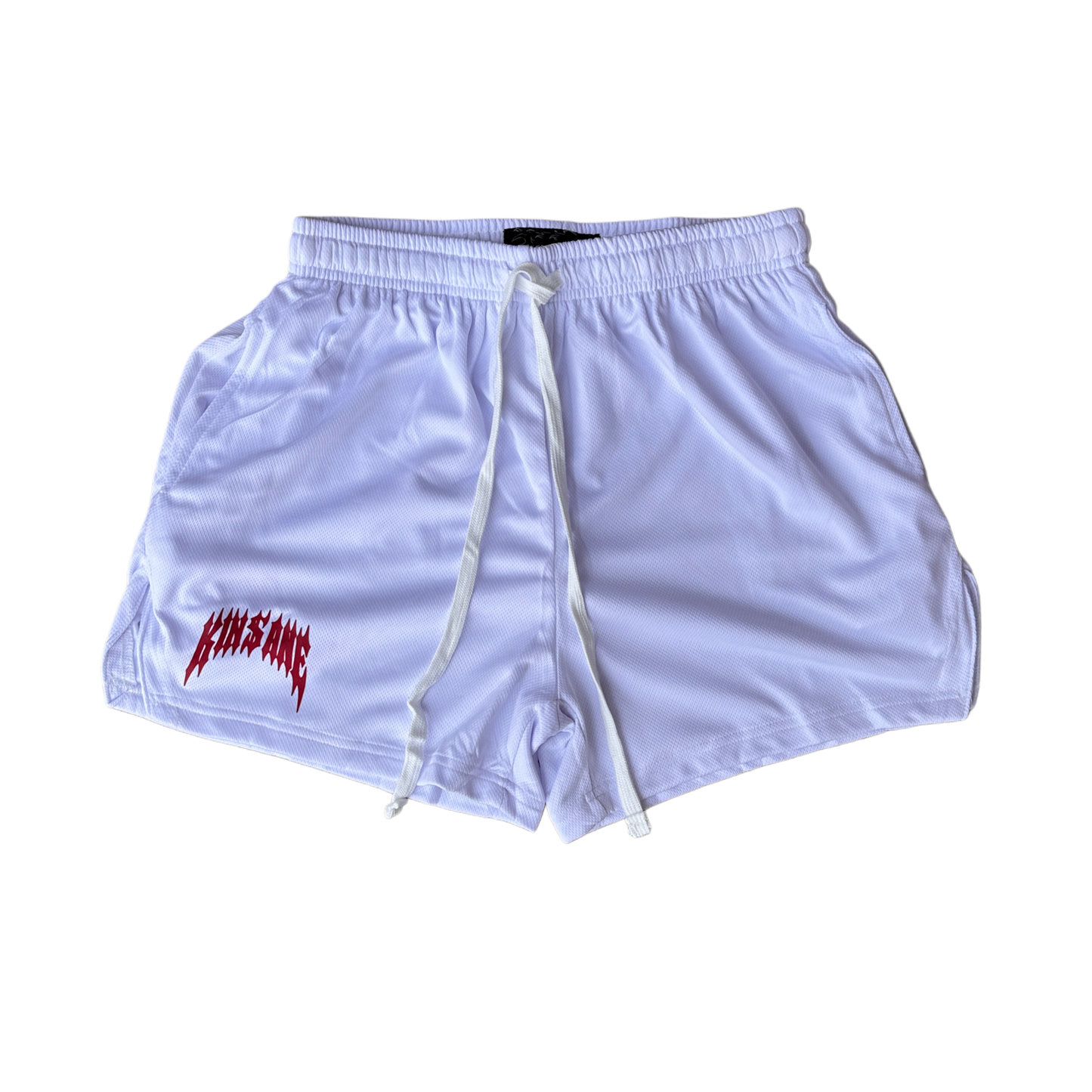 White athletic shorts with white drawstrings and red lettering on the right leg reading “KINSANE” 