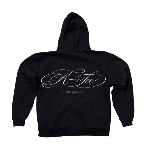 Back view of a black hoodie with white cursive text reading “K-Tec” and “Kinsane” 