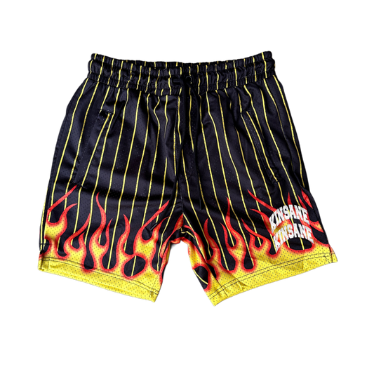Black and yellow shorts with flames design and two stacked white text reading “KINSANE” 