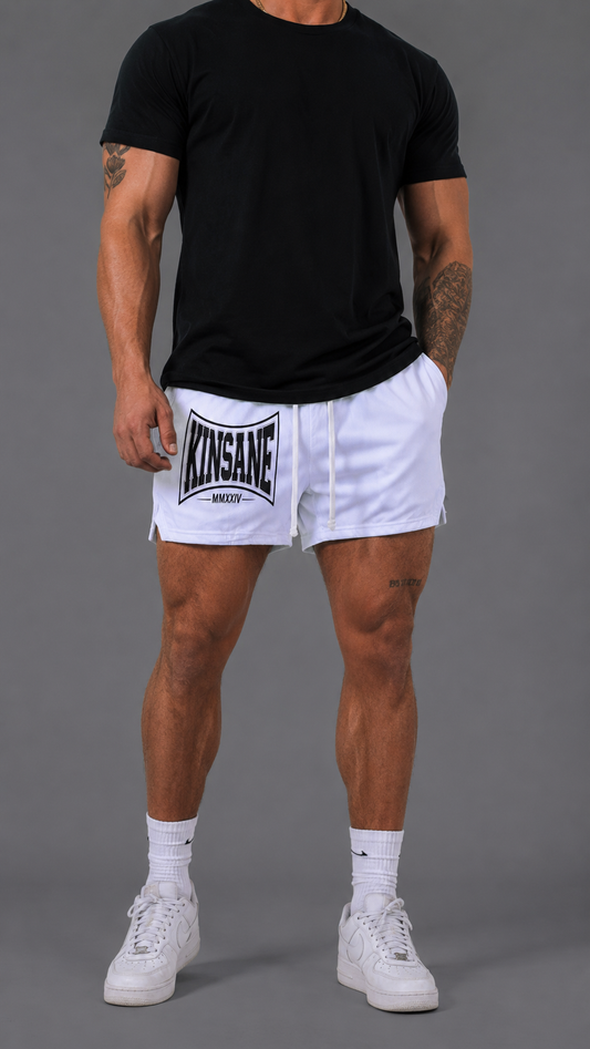 Man wearing White athletic shorts with white drawstrings and a black logo on the left side with text reading “KINSANE MMXXIV” 