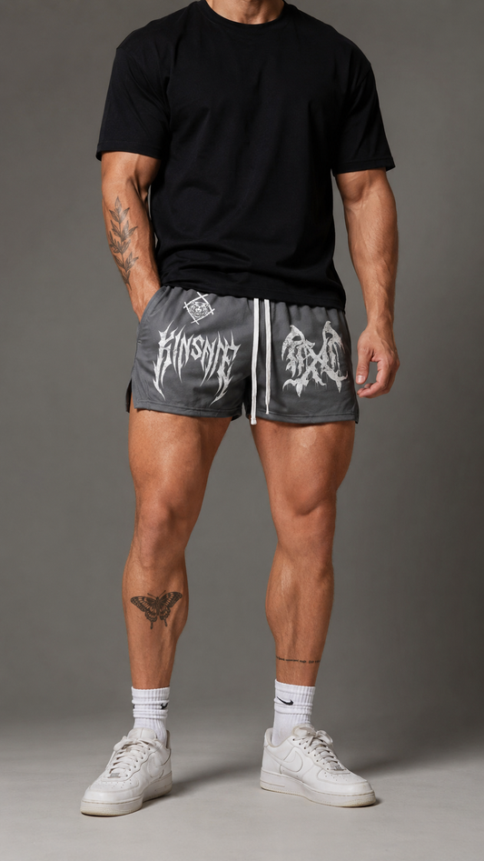 Man wearing Gray athletic shorts with white drawstrings and a white logo on the right side and a white logo and white text reading “KINSANE” on the left side 