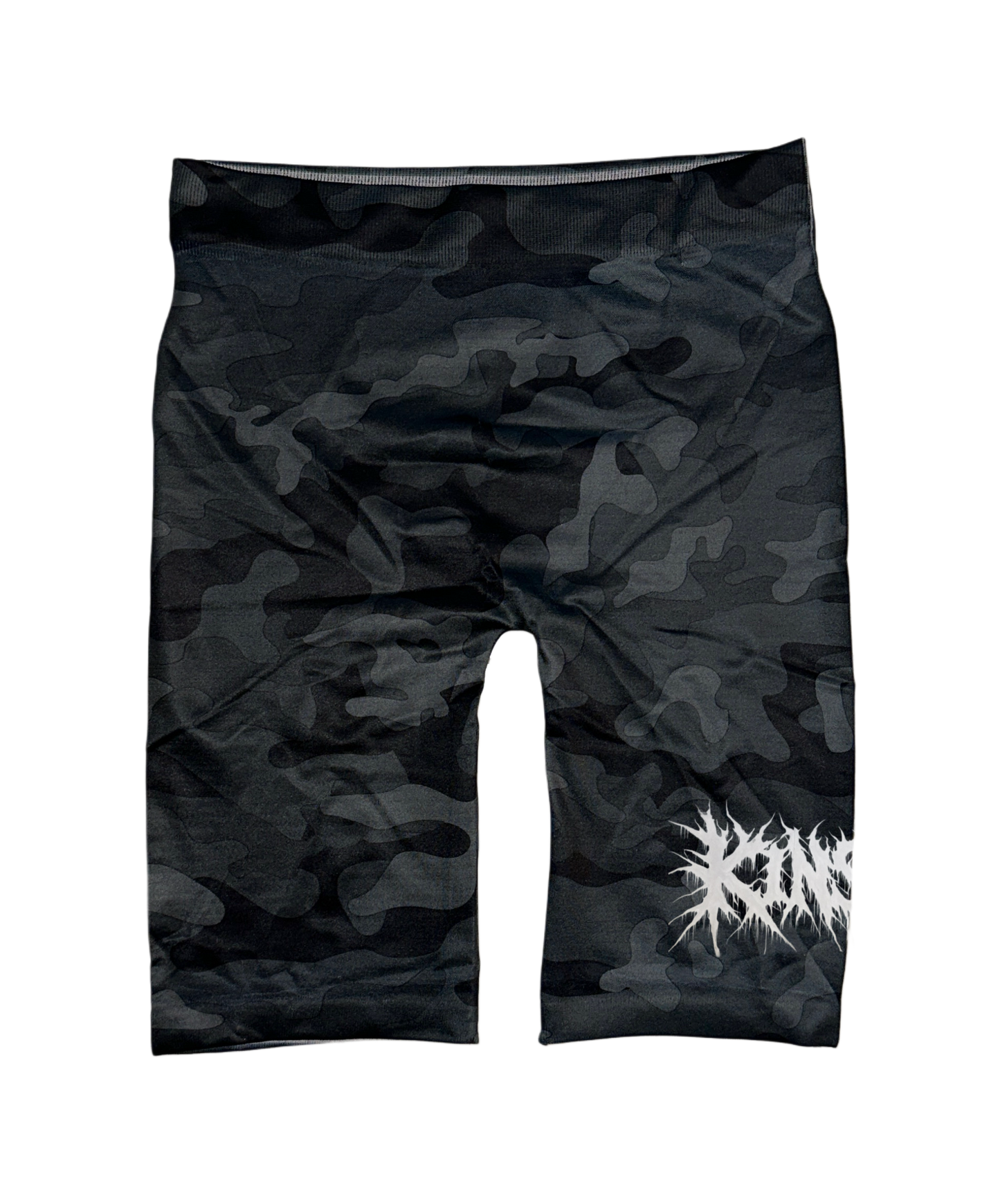 Black and grey camo compression shorts with white chaotic lettering reading “KIN” on the right leg 
