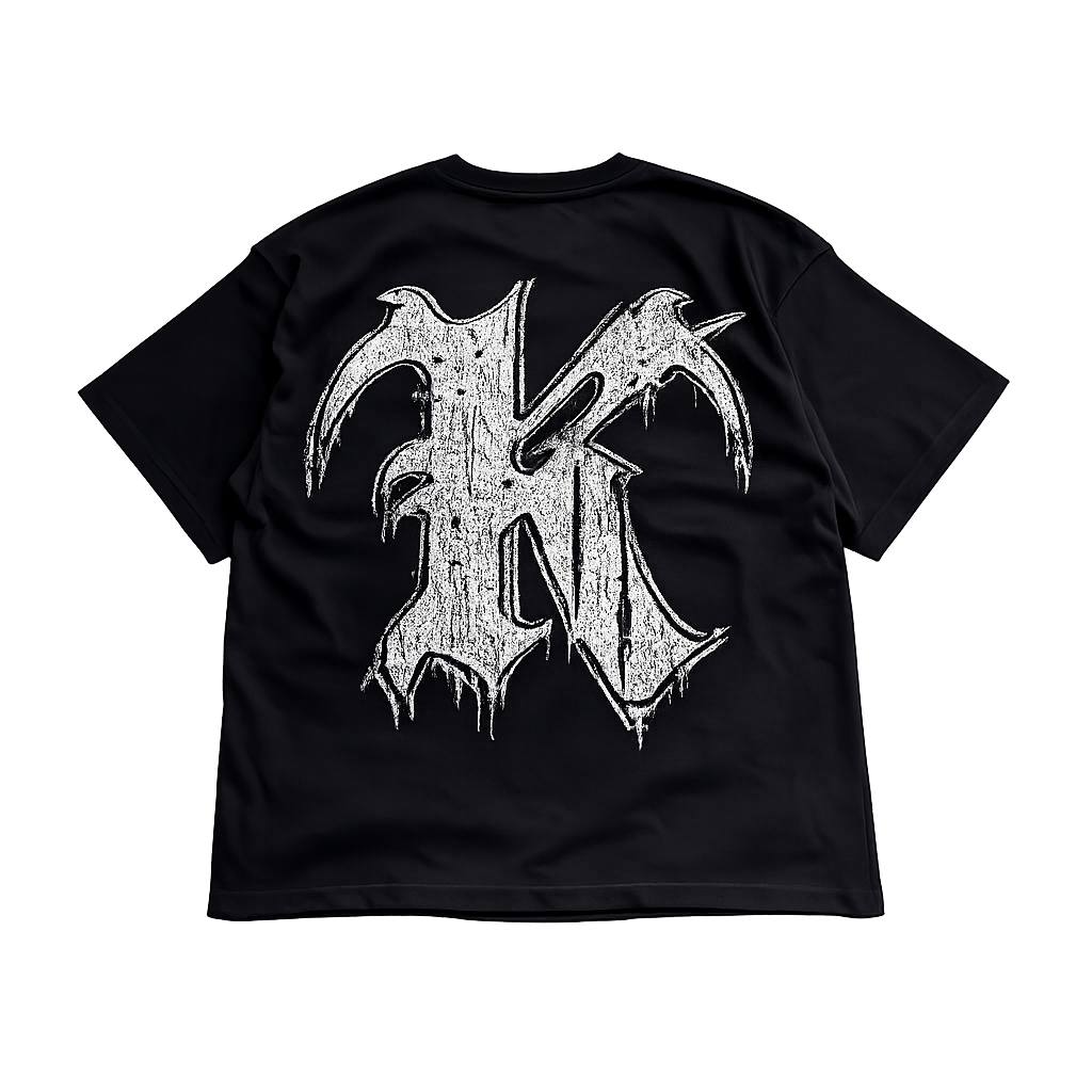 Back view of a black t shirt with a white and black logo of the letter “K”