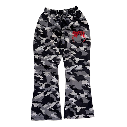 Camo baggy sweatpants with red tribal lettering on the right side reading “KINSANE” 