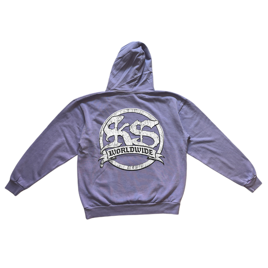 Back view of a light blue hoodie with a white logo reading “KS WORLDWIDE” 