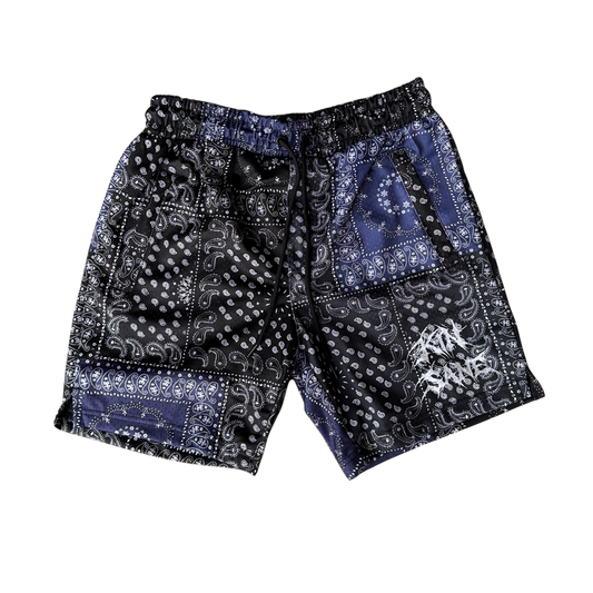 Black shorts with white and blue bandana design and black drawstrings and white lettering reading “KINSANE “ on the left leg 