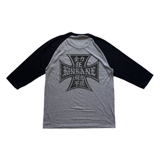 Back view of black and gray baseball raglan shirt with black logo with Japanese text and text reading “KINSANE” 