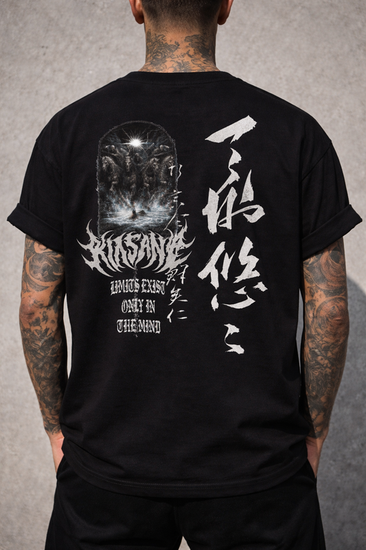 Back side of man wearing a black t shirt with a four horsemen design image and grey text reading “KINSANE” and white text reading “LIMITS EXIST ONLY IN THE MIND” and Japanese text translating to “limits exist only in the mind” 