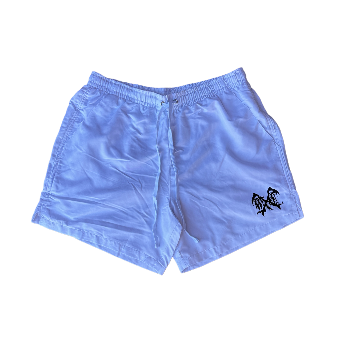 White trunks with a black logo on the left leg 