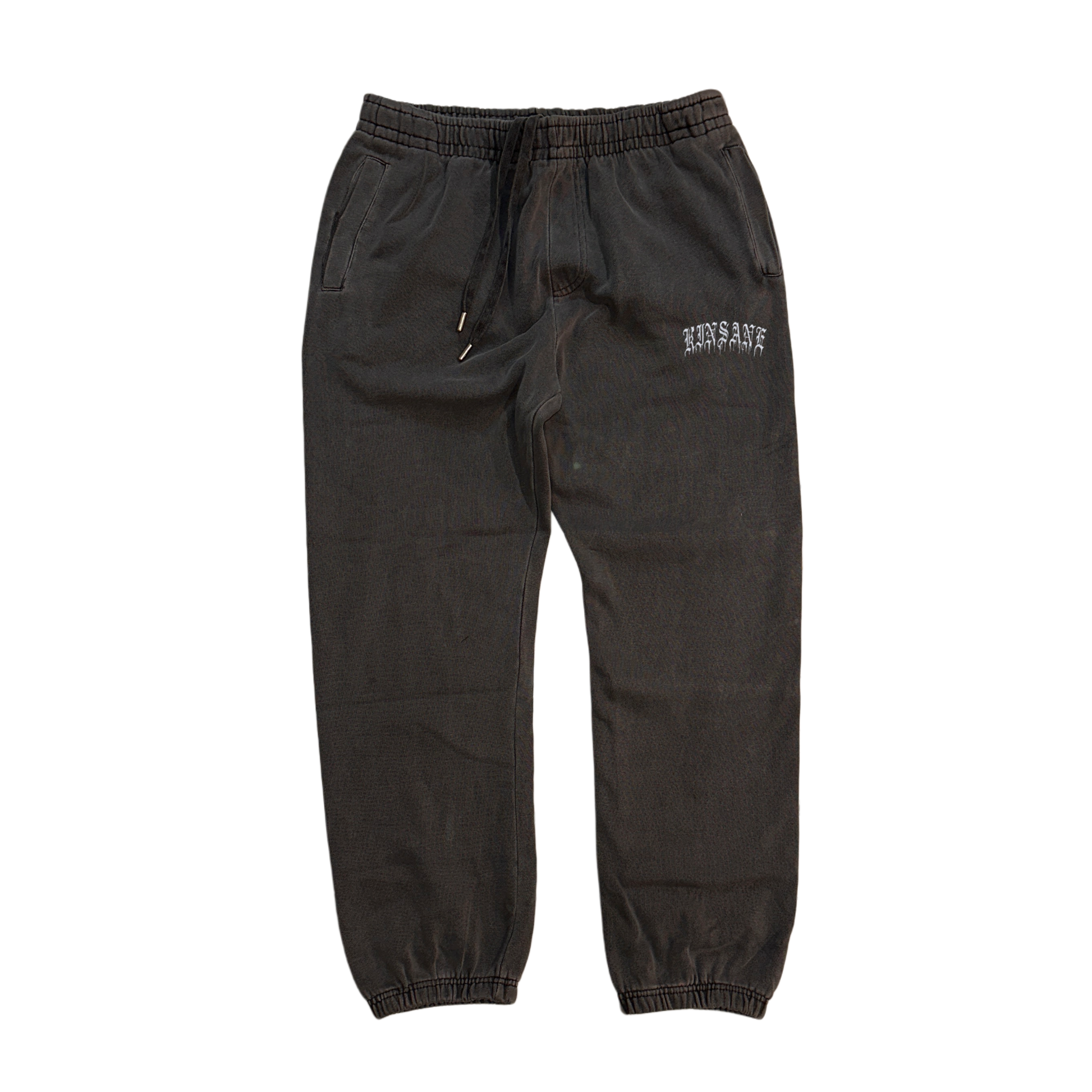 Gray cuffed joggers with white old English style lettering reading “KINSANE” on the right side 