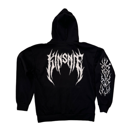 Back view of a black hoodie with white tribal lettering reading “KINSANE” and white tribal designs on the sleeve on the right side 