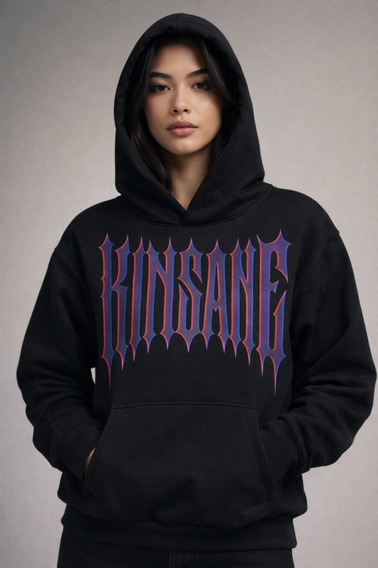 Girl wearing a black hoodie with dark purple spiked lettering reading “KINSANE” 