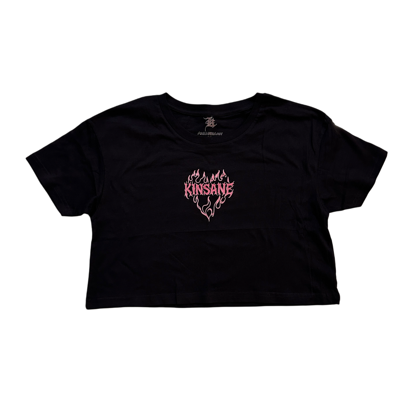 black crop top T-shirt with pink lettering reading “KINSANE” surrounded by pink flames in the shape of a heart 