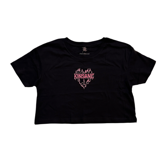 black crop top T-shirt with pink lettering reading “KINSANE” surrounded by pink flames in the shape of a heart 