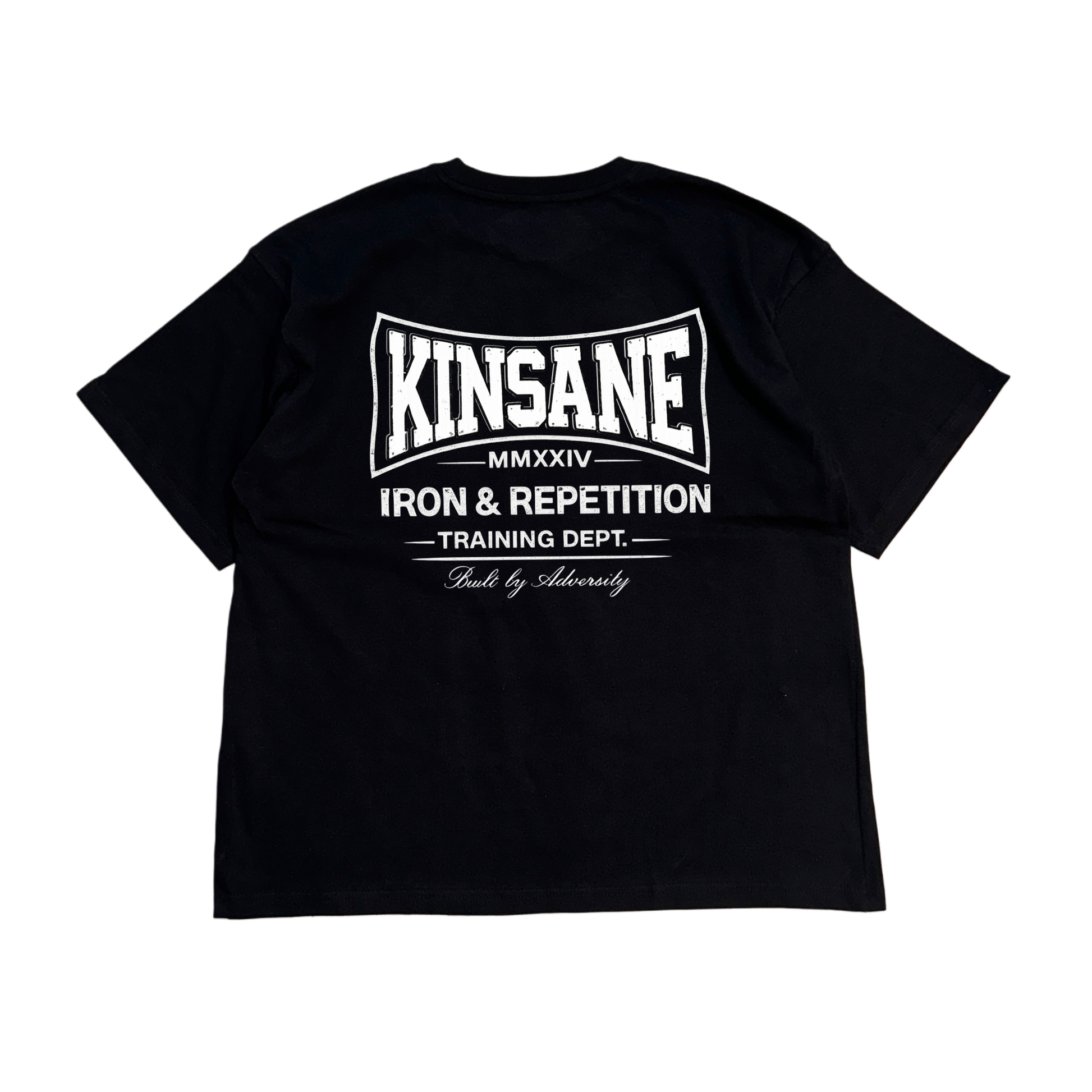 Back view of a black t shirt with white logo and white text reading “KINSANE MMXXIV IRON & REPETITION TRAINING DEPT. BUILT BY ADVERSITY” 