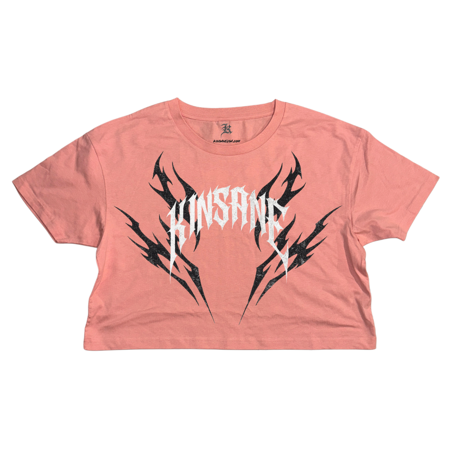 pink crop top T-shirt with black tribal designs and white lettering reading “KINSANE” 