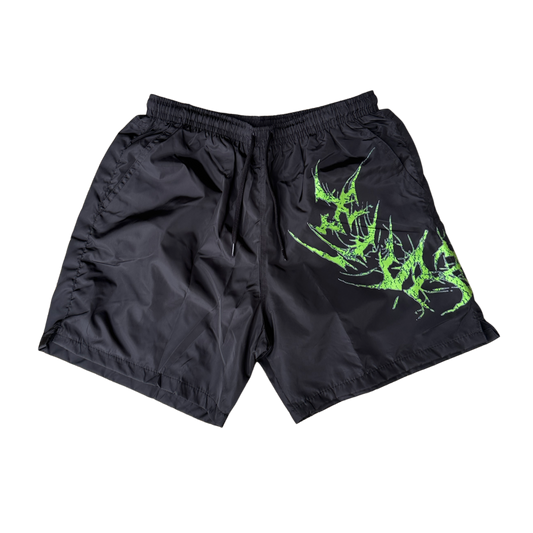 Black shorts with black drawstrings and neon green lettering on the left leg reading “KINSANE”