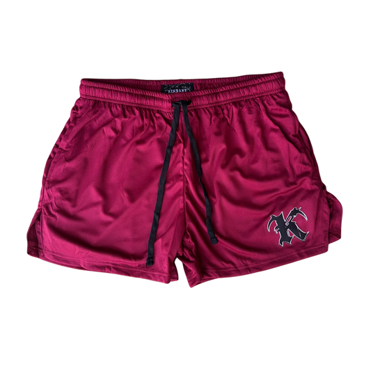 Dark red athletic shorts with black drawstrings and a black and silver “K” logo on the right side 