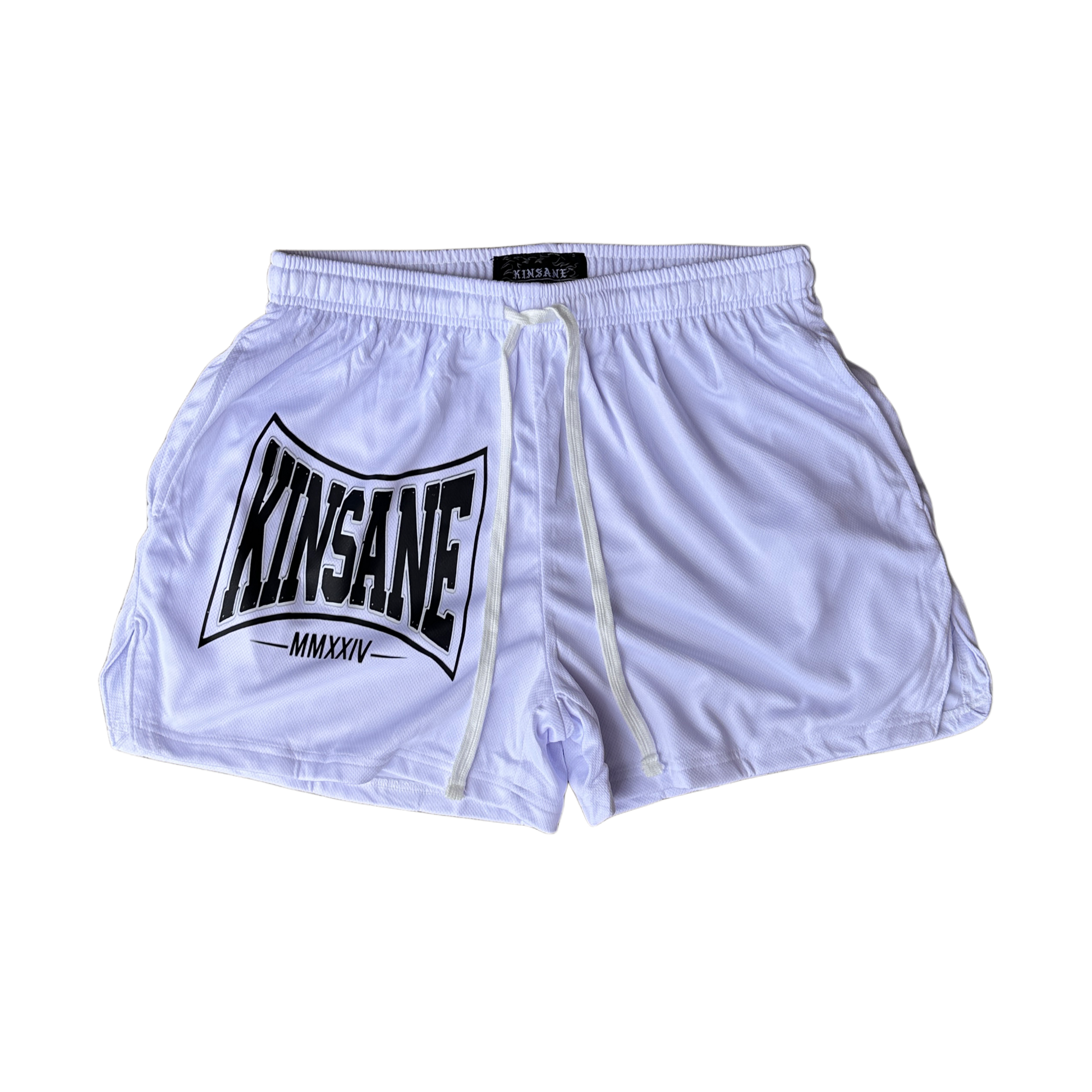 White athletic shorts with white drawstrings and a black logo on the left side with text reading “KINSANE MMXXIV” 