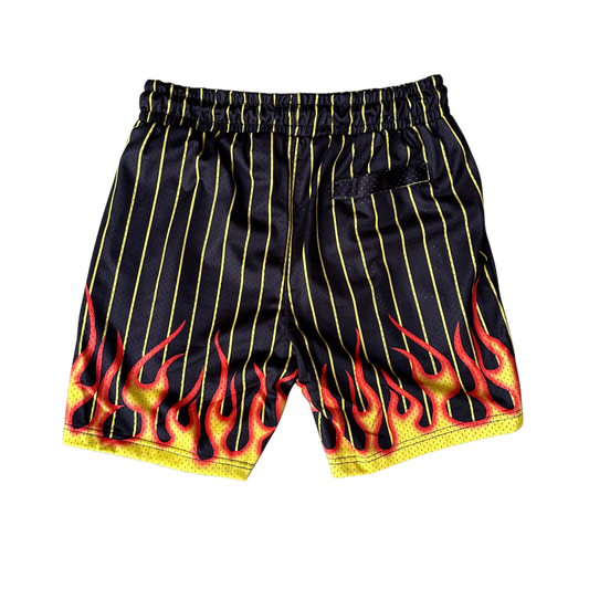 Back view of black and yellow shorts with flames design 