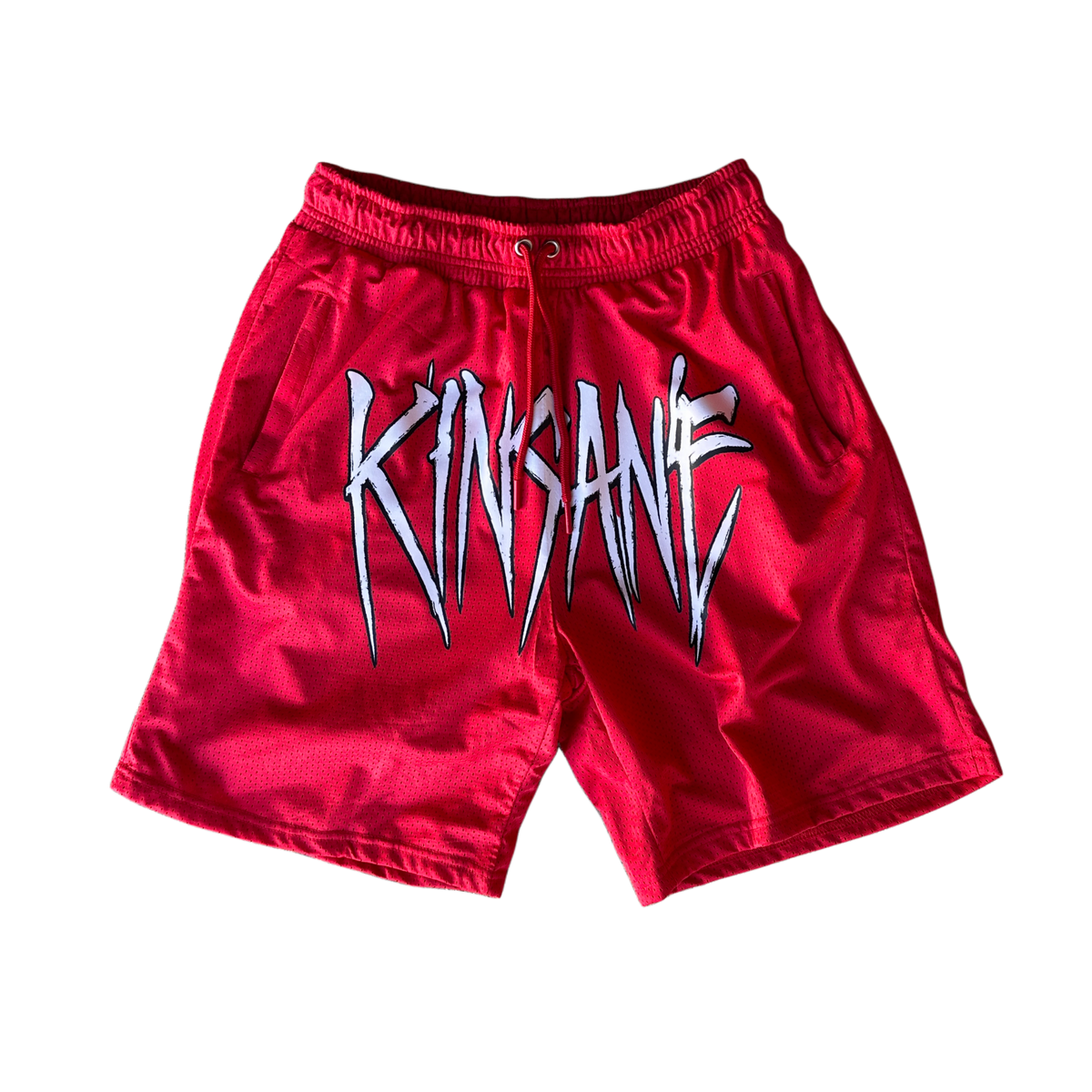 Red mesh shorts with red drawstrings and white text across the front reading “KINSANE”