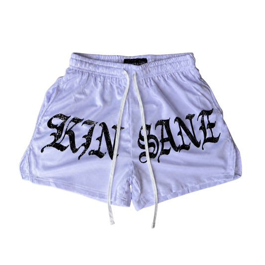White athletic shorts with white drawstrings and black lettering reading “KINSANE” on the front 