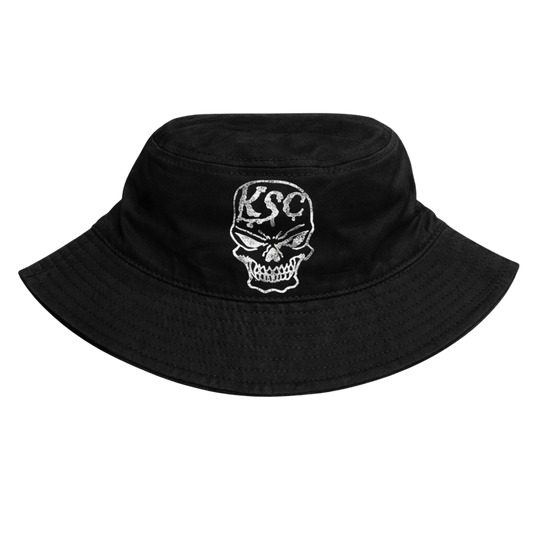 Black bucket hat with white skull design and white text reading “KSC” 