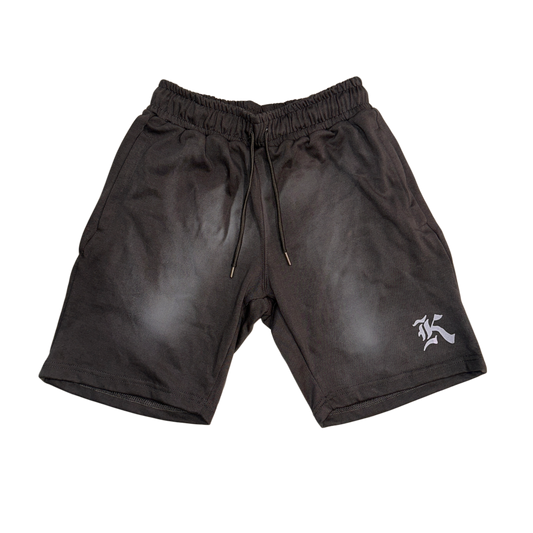 Gray vintage washed shorts with grey drawstrings and white “K” logo on the left leg 