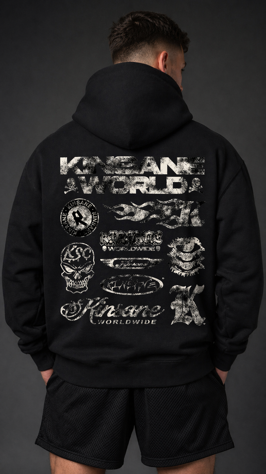 Back view of a man wearing a black hoodie with multiple white KINSANE logos grouped together 