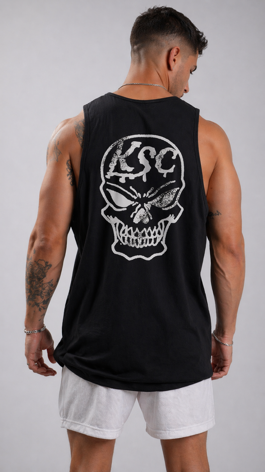 Back view of a man wearing a black tank top with a white skull design and white text reading “KSC” 