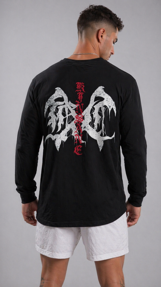 Back view of a man wearing a black long sleeve shirt with a white logo and red lettering reading “KINSANE” 