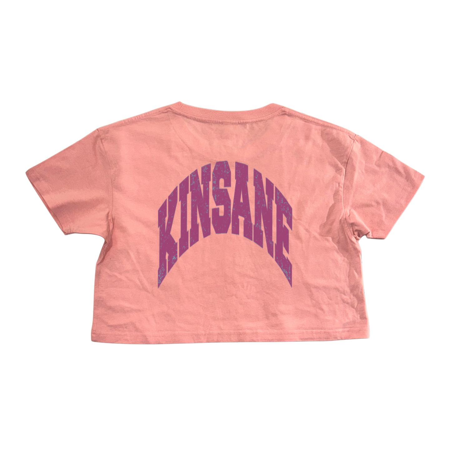 Back view of pink cropped top t shirt with purple text reading “KINSANE” 
