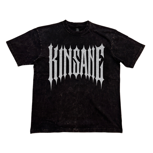 Black acid washed t-shirt with silver spiked lettering reading “KINSANE” 